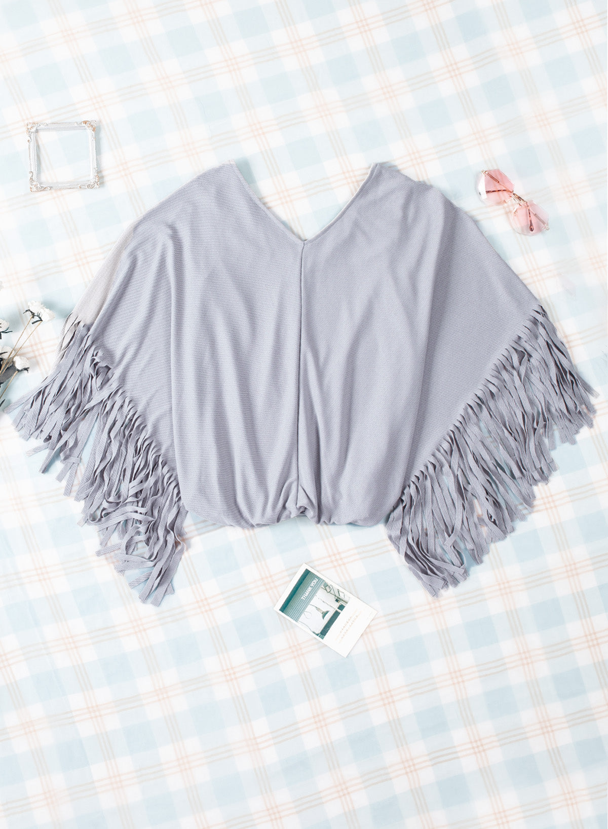 Haut à manches dolman et couture centrale à franges