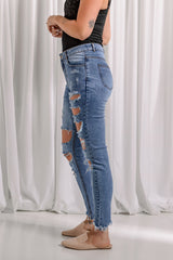 Jean skinny à ourlet brut effet usé