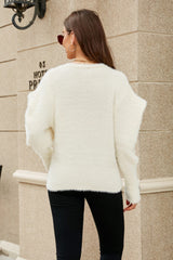 Flauschige Strickjacke mit Puffärmeln und V-Ausschnitt