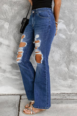 Jean évasé taille haute effet usé