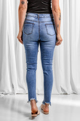 Jean skinny à ourlet brut effet usé