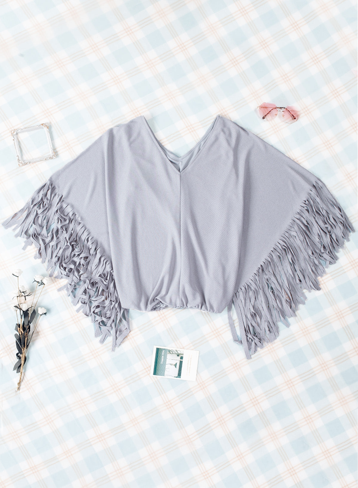 Haut à manches dolman et couture centrale à franges