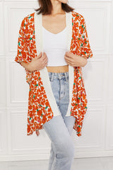 Justin Taylor – Kimono mit Zitrusblüten-Blumenmuster und Kontrastbesatz