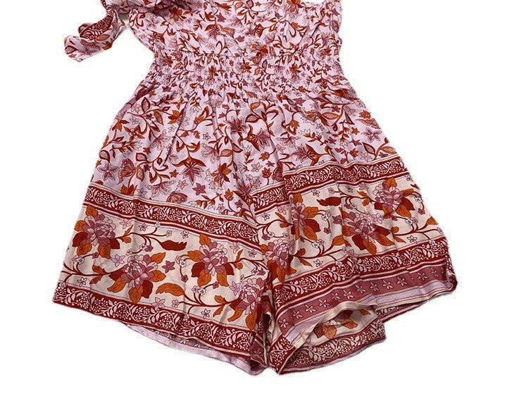 Ein-Schulter-ärmelloser Sling-Neckholder-Taille Enger kleiner gesmokter Strampler mit Blumenmuster