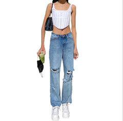 Jean déchiré taille haute avec effet liftant sur les hanches