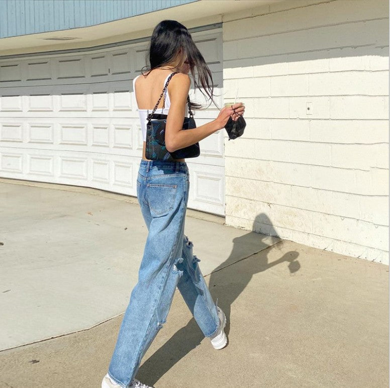 Jean déchiré taille haute avec effet liftant sur les hanches