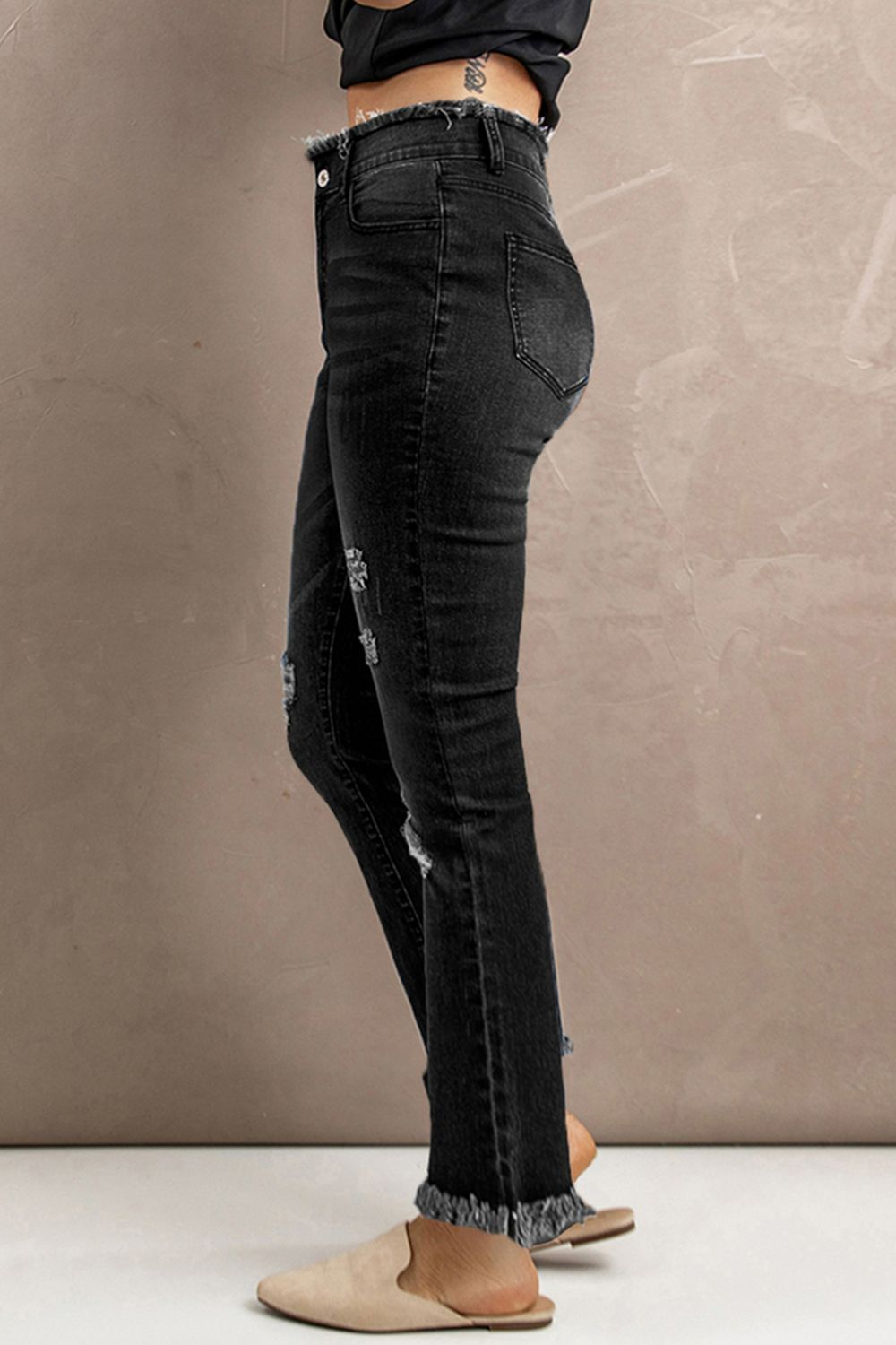 Jean taille haute à ourlet brut effet usé