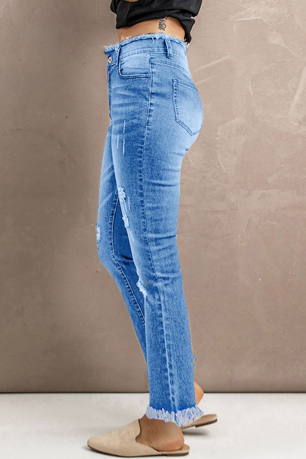 Jean taille haute à ourlet brut effet usé