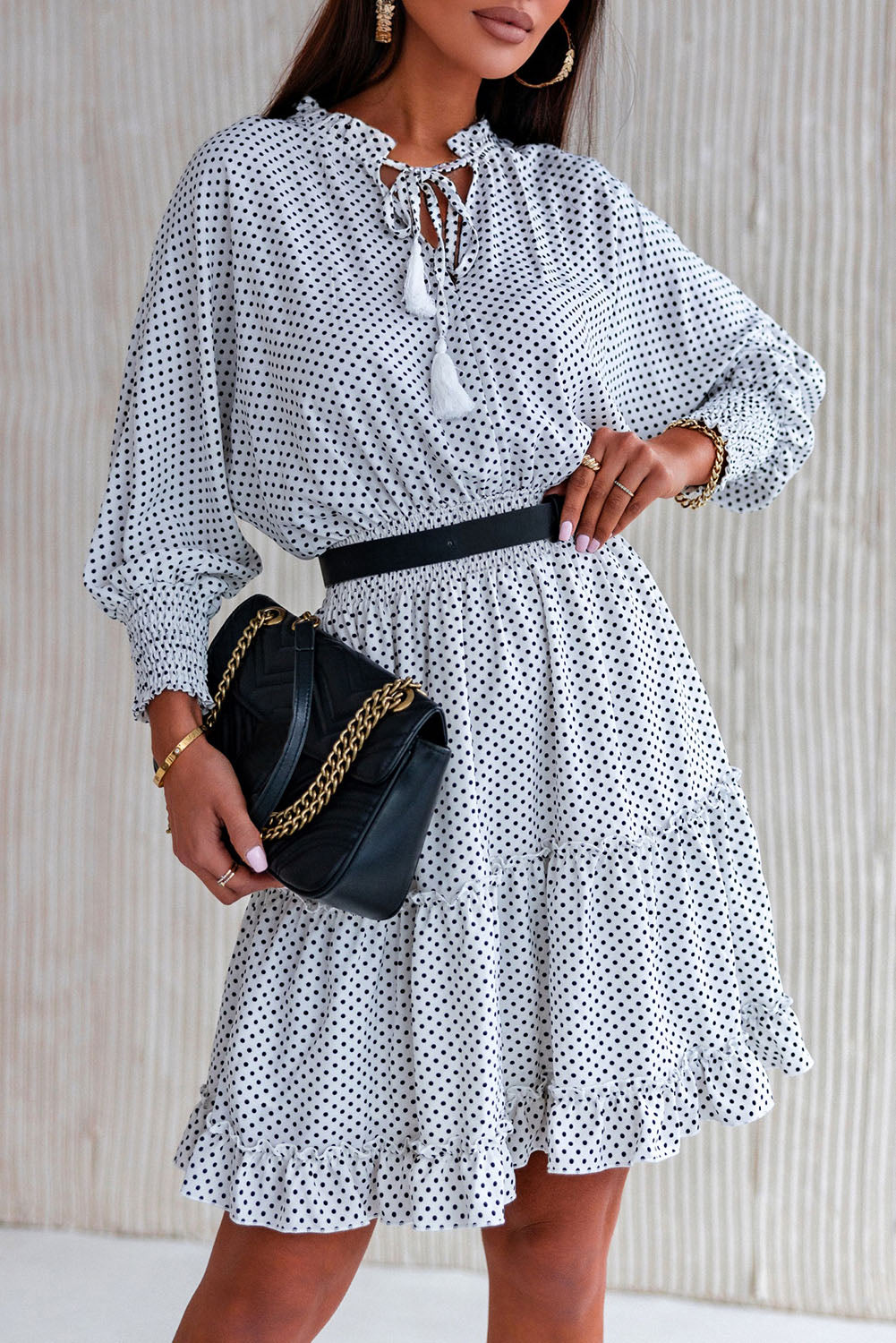 Robe à pois avec ourlet à volants et pompons